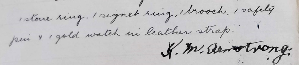 In old handwriting reads 'stone ring, signet ring, brooch, safety pin, gold watch in leather strap'. The signature below is in heavier ink and noticeably shaky while still being legible.