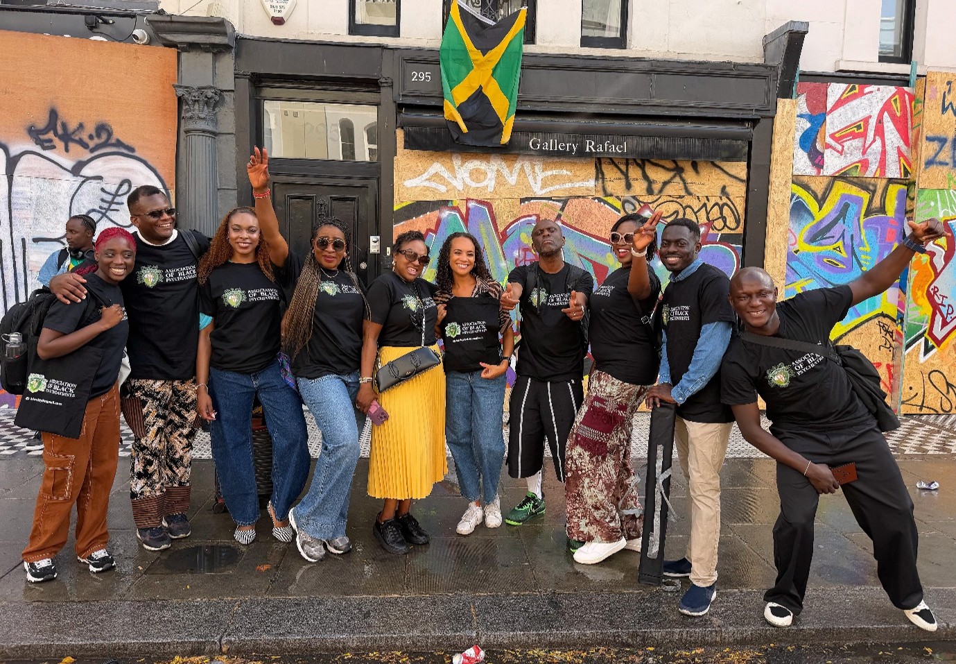 Group of people posing for a group shot on streets of London during Notting Hill Carnival
