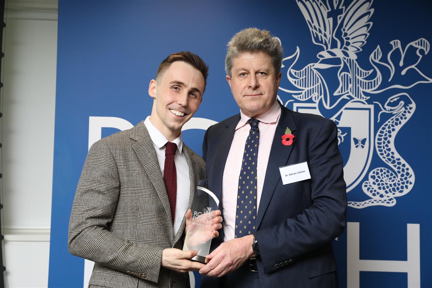 Thomas Hewson receives his award