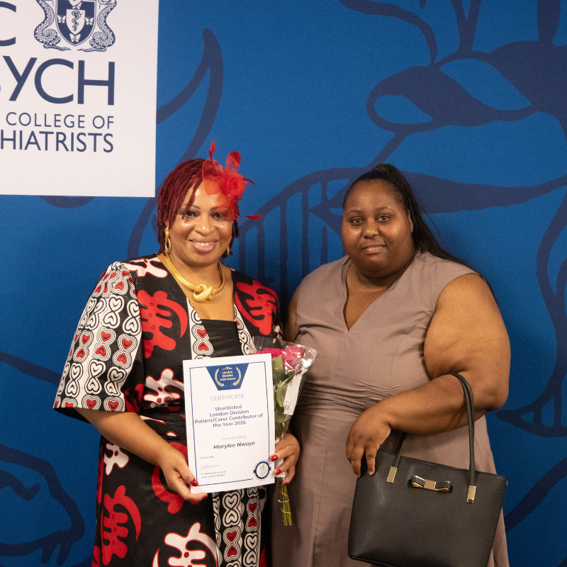 Marylee Nwoye holding certificate for runner up of patient / carer category