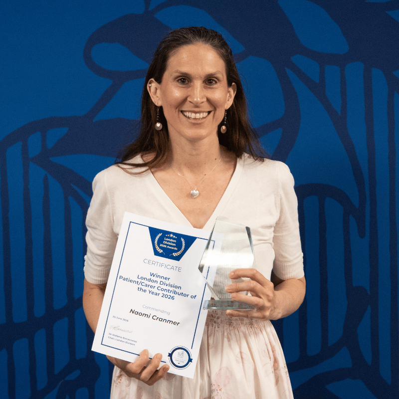Naomi Cranmer holding an award and prize for the patient / carer award