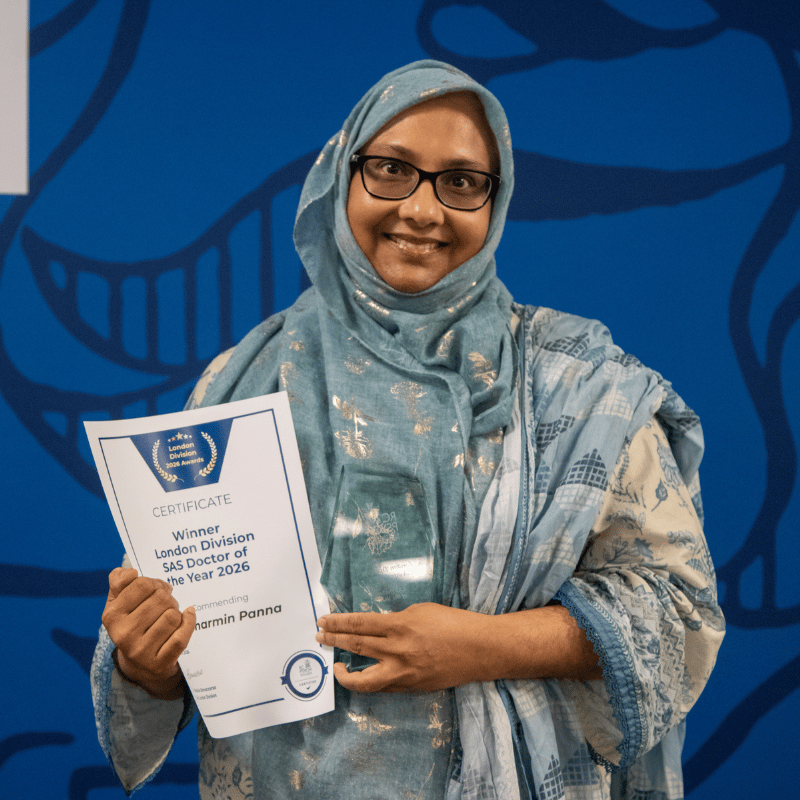 Sharmin Panna holding an award and certificate for winning the SAS Doctor of the year at the london division awards