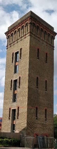 Red brick tower of at least 5 storeys