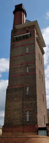 Red brick tower of at least 5 storeys